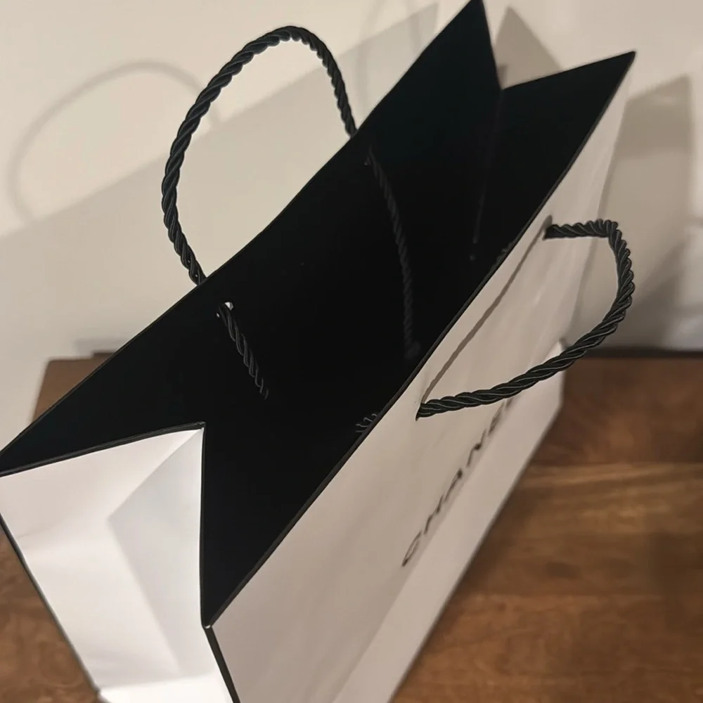 Authentic CHANEL gift bag. 10.5 x 9 x 4.5 in. White with logo in black